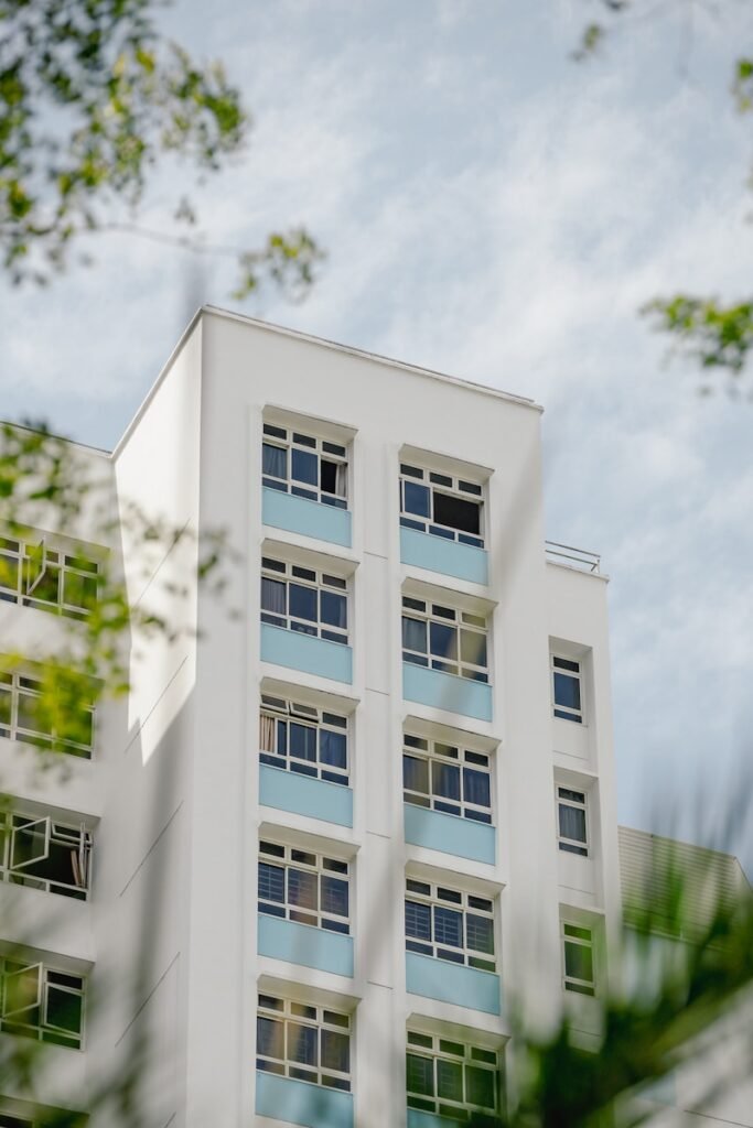 A tall white building with lots of windows